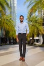 Full length shot of handsome black African businessman outdoors in city during summer Royalty Free Stock Photo