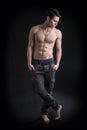Full length shot of handsome, fit shirtless young man wearing only pants Royalty Free Stock Photo