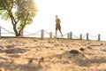 Full length shot of healthy young man running on the promenade. Male runner sprinting outdoors Royalty Free Stock Photo