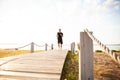 Full length shot of healthy young man running on the promenade. Male runner sprinting outdoors Royalty Free Stock Photo