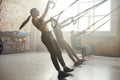 Shape it up. Full-length shot of man and women doing fitness TRX training exercises at industrial gym. Push-up, group Royalty Free Stock Photo