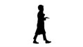 Silhouette Female scientist making a call walking. Royalty Free Stock Photo