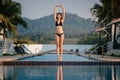 Full length shot of a slim young woman in swimwear at the poolside Royalty Free Stock Photo