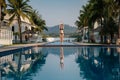 Full length shot of a slim young woman in swimwear at the poolside Royalty Free Stock Photo