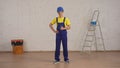 Full length shot of a smiling young construction worker standing in the room under renovation giving a thumbs up. Royalty Free Stock Photo