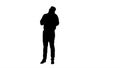 Silhouette Man talking on the phone and making notes. Royalty Free Stock Photo