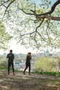 Full length shot of young african fitness couple in sportswear exercising with dumbbells while working out together Royalty Free Stock Photo