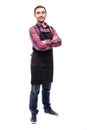 Full length shot of young chef or waiter posing, wearing black apron and shirt isolated on white background Royalty Free Stock Photo