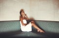 Enjoying the simple things in life. Full length shot of a young woman relaxing in the sauna at a spa. Royalty Free Stock Photo