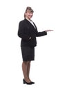 Full length, side view of a confident young business woman standing with folded hands Royalty Free Stock Photo