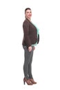Full length, side view of a confident young business woman standing with folded hands Royalty Free Stock Photo