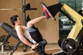 Young man exercising at the leg press during lower body workout Royalty Free Stock Photo