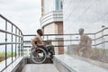 Black Man in Wheelchair using Ramp Royalty Free Stock Photo