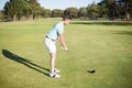 Full length side view of young man playing golf