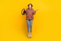 Full length size photo of jumping funky girl dilemma wear hoodie shrug shoulders which way to turn road isolated on Royalty Free Stock Photo