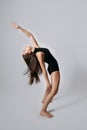 Full length studio portrait of exciting expressive emotional young woman with long hair. Fashionable stylish girl in