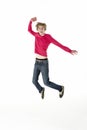 Full Length Studio Portrait Of Jumping Teenage Boy Royalty Free Stock Photo