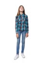 Teen girl in checkered shirt standing casually looking up