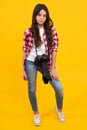 Full length of teenager girl with dslr professional photo camera with big photo lens. Child photographer isoalted on Royalty Free Stock Photo