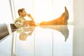 Full length of thoughtful businessman with diary in conference room Royalty Free Stock Photo