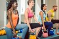 Three young people holding kettlebells during functional training Royalty Free Stock Photo