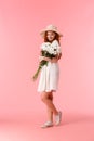 Full-length vertical shot lovely, sensual and romantic redhead woman in white dress, summer straw hat, receive beautiful