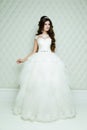 Full length view on beautiful woman posing in a wedding dress. Royalty Free Stock Photo