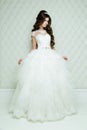 Full length view on beautiful woman posing in a wedding dress. Royalty Free Stock Photo