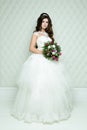 Full length view on beautiful woman posing in a wedding dress. Royalty Free Stock Photo