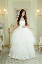 Full length view on beautiful woman posing in a wedding dress. Royalty Free Stock Photo