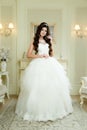 Full length view on beautiful woman posing in a wedding dress. Royalty Free Stock Photo