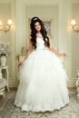 Full length view on beautiful woman posing in a wedding dress. Royalty Free Stock Photo