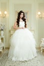 Full length view on beautiful woman posing in a wedding dress. Royalty Free Stock Photo