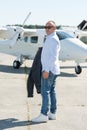 Full length view casually dressed man at airodrome Royalty Free Stock Photo