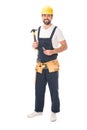 full length view of handsome repairman holding tools and smiling at camera Royalty Free Stock Photo