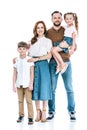 full length view of happy family with two children standing together and smiling at camera Royalty Free Stock Photo