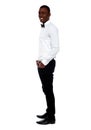 Full length view of smart young man. Side pose