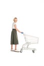 full length view of upset young woman standing with empty shopping cart Royalty Free Stock Photo