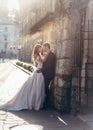 Full Length Wedding Portrait Beautiful Happy Newlywed Couple Tenderly Hugging Leaning Wall Town City Street Sunset Lviv.