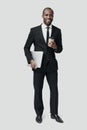 Full length of young African man in formalwear