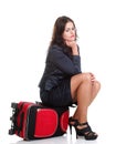 Full length young business woman to late red travel bagd Royalty Free Stock Photo