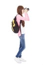 Full length young girl taking a picture using digital camera Royalty Free Stock Photo