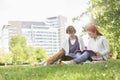 Full length of young male and female friends studying at college campus Royalty Free Stock Photo