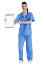 Full length of young nurse pointing clipboard