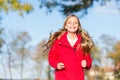 Full of life energy. Child cheerful on fall walk. Warm coat best choice for autumn. Autumn outfit concept. Kid girl wear