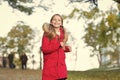 Full of life energy. Child cheerful on fall walk. Warm coat best choice for autumn. Keep body warm clothes autumn days