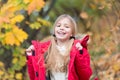 Full of life energy. Kid girl wear coat for autumn season nature background. Child cheerful on fall walk. Warm coat best Royalty Free Stock Photo