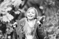 Full of life energy. Kid girl wear coat for autumn season nature background. Child cheerful on fall walk. Warm coat best