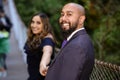 Full of love photo of an affectionate mixed race young couple holding each other on a suspension bridge at sunset Royalty Free Stock Photo