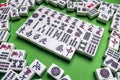 Full of Mahjong tiles on green background